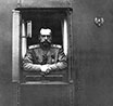 Император Николай II в окне салон-вагона императорского поезда. Май 1916 г. Фотография из альбома в.к. Ольги Николаевны.